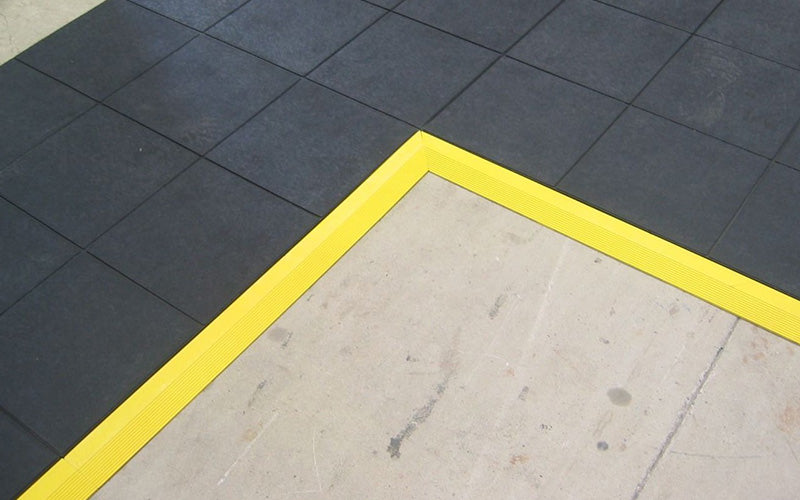 Insitu product image of 24/Seven Interlocking Rubber mat with yellow safety ramps in warehouse