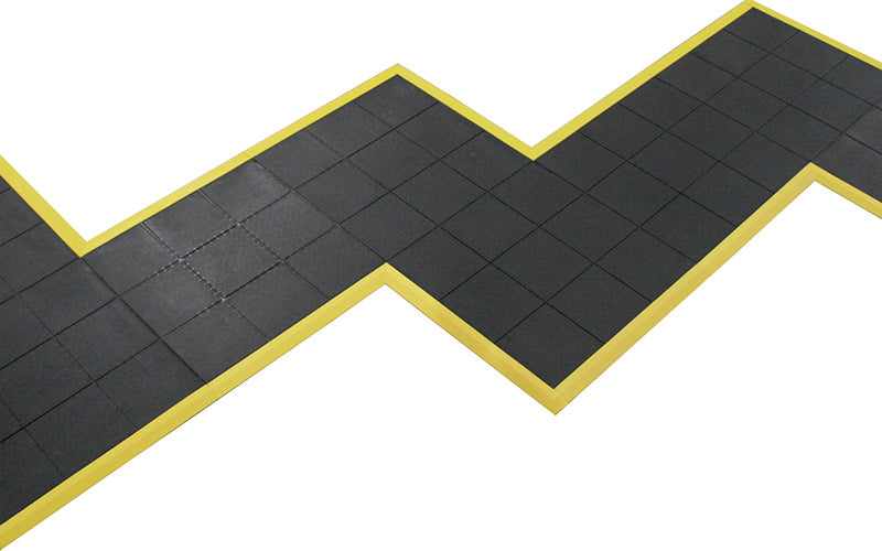 Product image of rubber 24/Seven Interlocking Rubber mat with yellow safety ramps in zig-zag formation