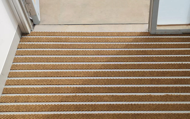 Insitu image of Camel Superguard inserts in Aluminium Architecture Matting in doorway- Made to Measure