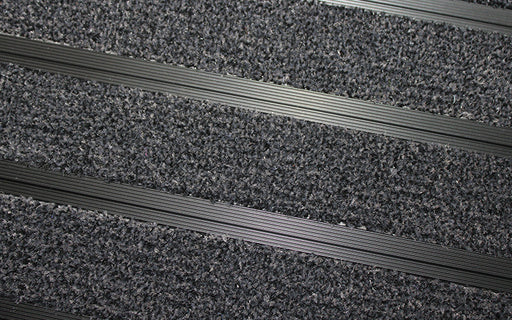 Close up image of Black Granati inserts in Black ARCHIMAT aluminium architectural matting