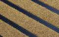Close up image of Brown Metro inserts in Black ARCHIMAT aluminium architectural matting