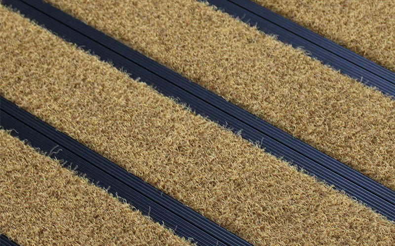Close up image of Brown Metro inserts in Black ARCHIMAT aluminium architectural matting