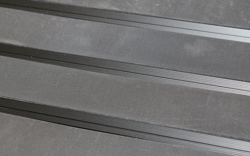 Close up image of Ply Insertion Rubber inserts in Black ARCHIMAT aluminium architectural matting