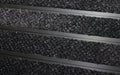Close up image of Black Reno inserts in Black ARCHIMAT aluminium architectural matting
