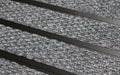 Close up image of Mid Grey Superguard inserts in Black ARCHIMAT aluminium architectural matting
