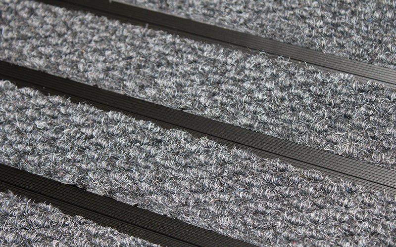 Close up image of Mid Grey Superguard inserts in Black ARCHIMAT aluminium architectural matting