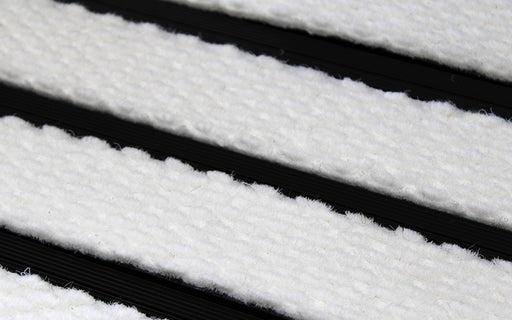 Close up image of White Superguard inserts in Black ARCHIMAT aluminium architectural matting