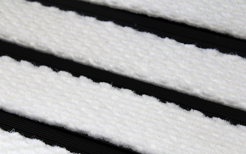 Close up image of White Superguard inserts in Black ARCHIMAT aluminium architectural matting