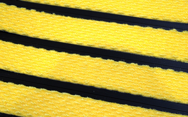 Close up image of Yellow Superguard inserts in Black ARCHIMAT aluminium architectural matting