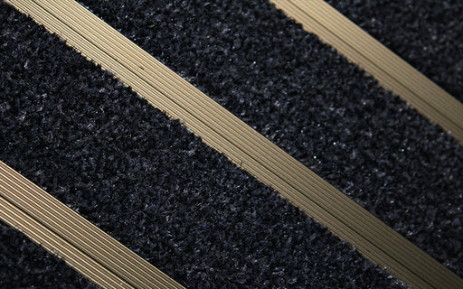 Close up image of Black Granati inserts in Bronze ARCHIMAT aluminium architectural matting
