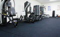 Insitu product image of our rubber black with blue flecked gym mats in a commercial gym set up
