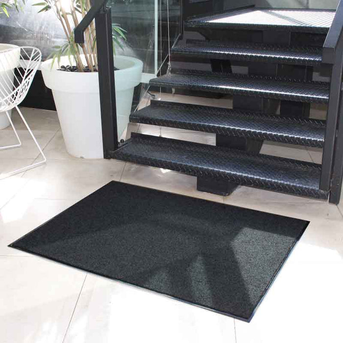 Insitu product image of Black Dirtstopper Mat at the bottom of staircase