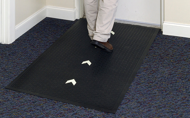 Insitu image of someone using a glow hog mat to find the nearest exit as the arrows glow in the dark and are perfect for emergencies.
