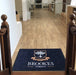 Insitu product image of PrintPlush Logo Mat at the base of stairs at a early education facility