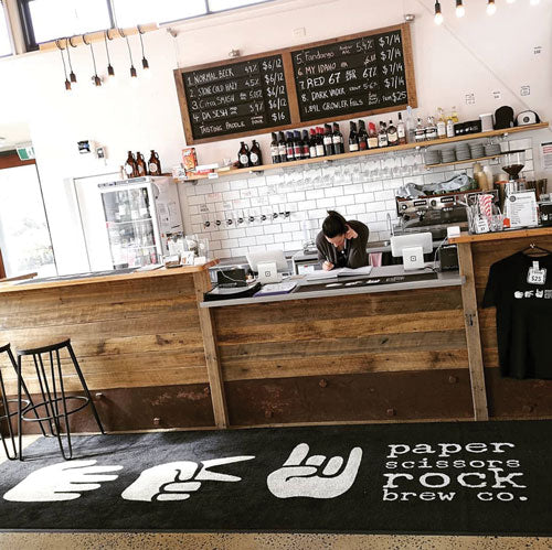 Insitu product image of PrintPlush Logo Mat at a cafe