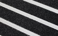 Close up image of Black Granati inserts in Silver ARCHIMAT aluminium architectural matting
