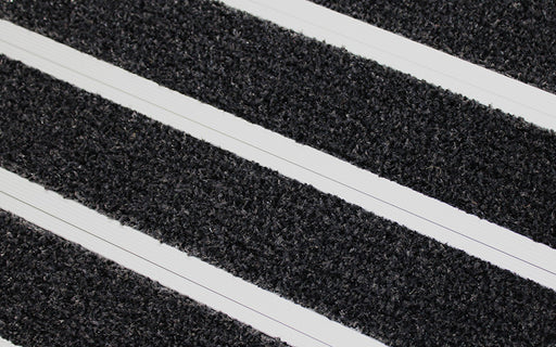 Close up image of Black Granati inserts in Silver ARCHIMAT aluminium architectural matting