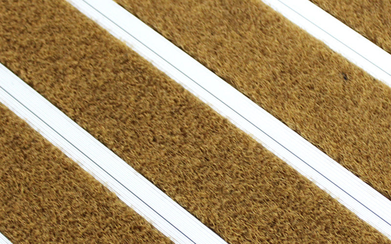 Close up image of Brown Metro inserts in Silver ARCHIMAT aluminium architectural matting