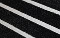 Close up image of Black Reno inserts in Silver ARCHIMAT aluminium architectural matting