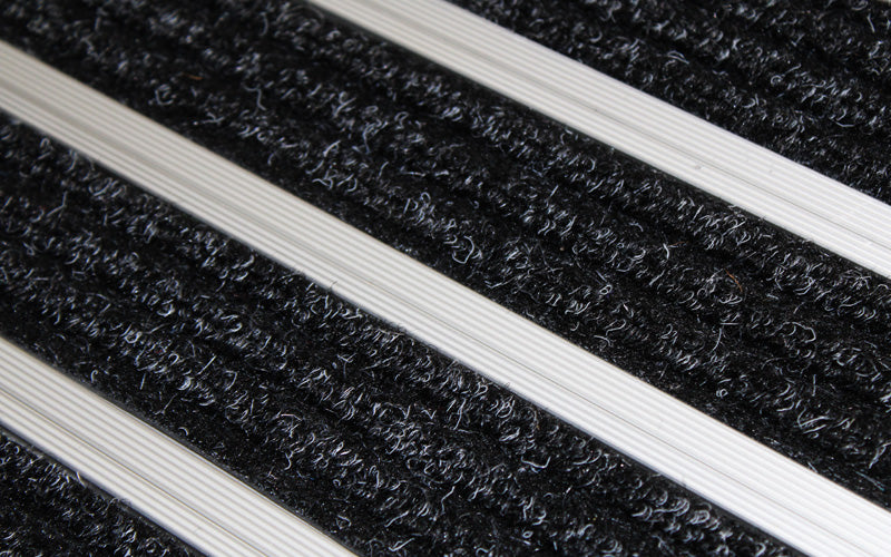 Close up image of Super Brush inserts in Silver ARCHIMAT aluminium architectural matting