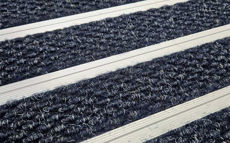Close up image of Denim Superguard inserts in Silver ARCHIMAT aluminium architectural matting