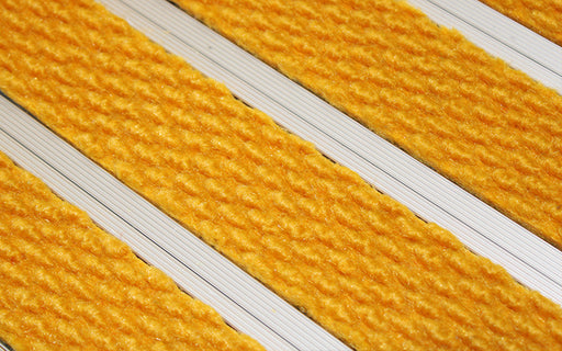 Close up image of Gold Superguard inserts in Silver ARCHIMAT aluminium architectural matting