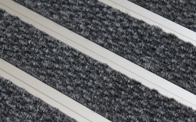 Close up image of Mid Grey Superguard inserts in Silver ARCHIMAT aluminium architectural matting