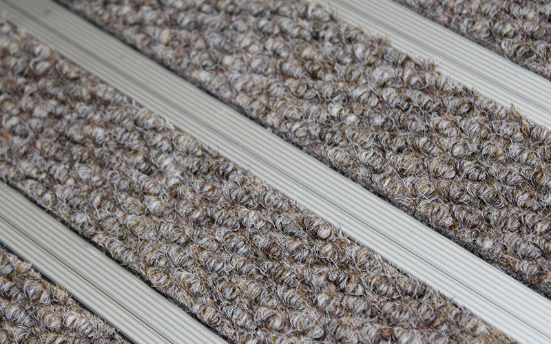 Close up image of Natural Beige Superguard inserts in Silver ARCHIMAT aluminium architectural matting