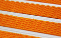 Close up image of Orange Superguard inserts in Silver ARCHIMAT aluminium architectural matting