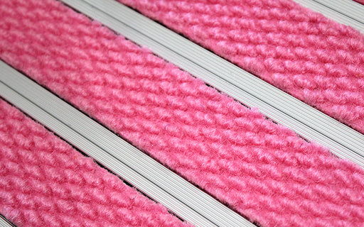 Close up image of Pink Superguard inserts in Silver ARCHIMAT aluminium architectural matting