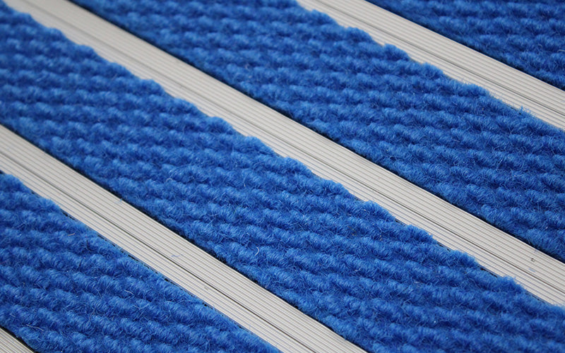 Close up image of Royal Blue Superguard inserts in Silver ARCHIMAT aluminium architectural matting