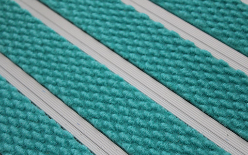 Close up image of Turquoise Superguard inserts in Silver ARCHIMAT aluminium architectural matting