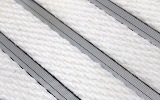 Close up image of White Superguard inserts in Silver ARCHIMAT aluminium architectural matting