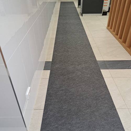 Insitu image of SmartGrip Mat used to absorb moisture in a tiled hallway.