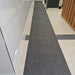 Insitu image of SmartGrip Mat used to absorb moisture in a tiled hallway.