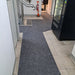 Insitu image of SmartGrip Mat used to prevent slippery situations in a tiled hallway.