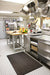 Insitu product image of black Soft-n-Safe Rubber Anti-fatigue mat in commercial kitchen