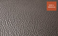 Close up product image of black rubber stable mat with hammertop surface