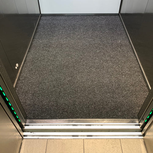 Insitu image of the superguard charcoal mat installed into a lift.