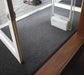 Insitu image of the superguard charcoal entrance mat installed into entry doors with security scanners.