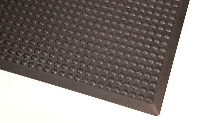 Corner product image of anti-fatigue, black, rubber Supreme Comfort Mat