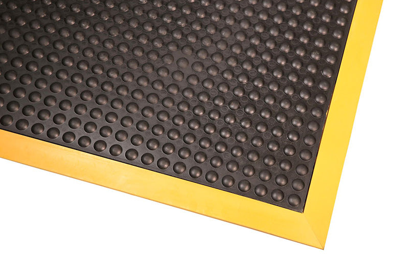 Corner product image of anti-fatigue, black and yellow, rubber Supreme Comfort Mat