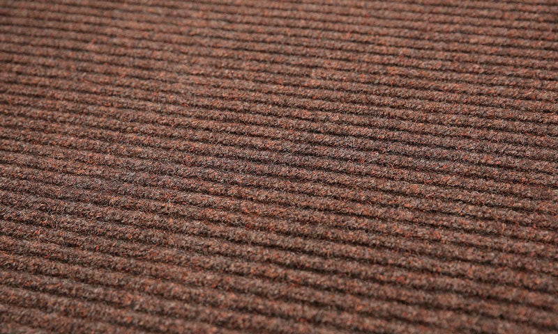 Close up product image of brown, polypropylene Tough Rib Mat made for commercial and residential entrances