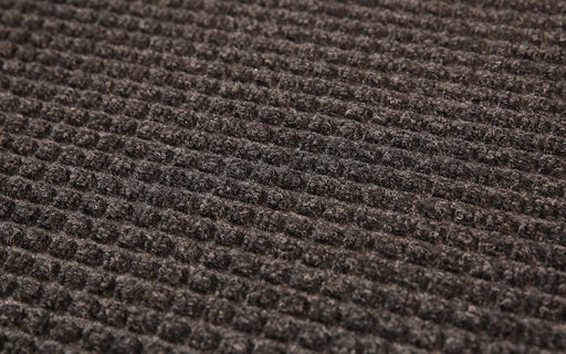 Close up product image of charcoal, polypropylene Waterhog Classic Mat made for commercial and residential entrances