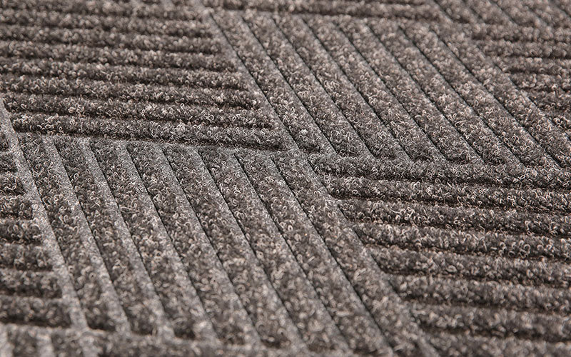 Close up product image of charcoal, polypropylene Waterhog Eco Premier Mat made for commercial and residential entrances