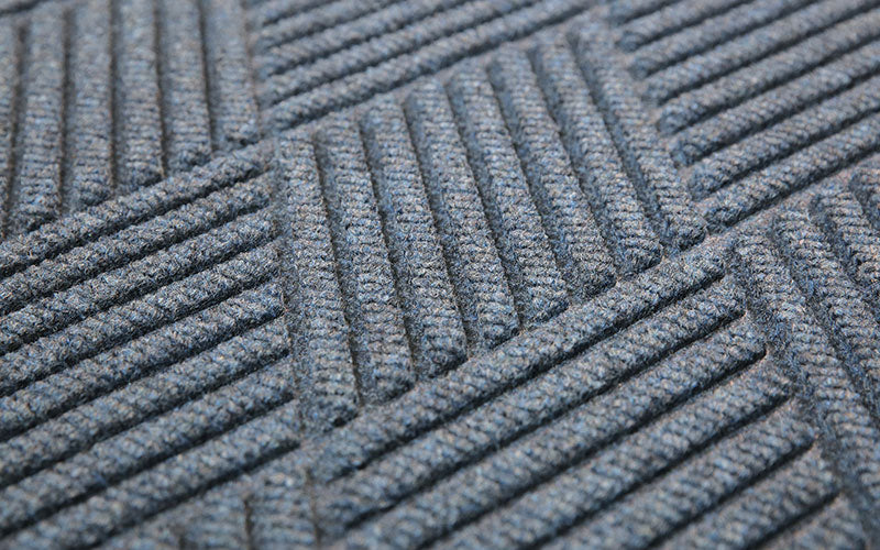 Close up product image of bluestone, polypropylene Waterhog Eco Premier Mat made for commercial and residential entrances