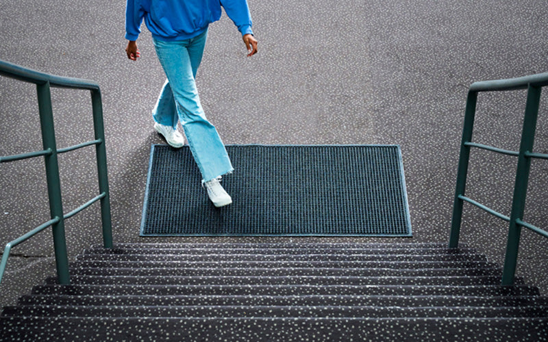 Insitu image of a charcoal classic waterhog mat used for an outdoor entryway