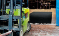 Insitu image of a Waterhog Truck mat used inside an industrial warehouse to help when moving pallets.