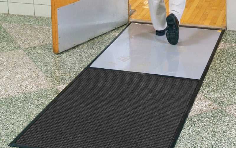 Insitu image of a Clean Stride Mat used by an entrance to effectively remove dirt and dust like ina health care facility,