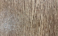 Close up image of the wood grain design on the standing desk mat.
